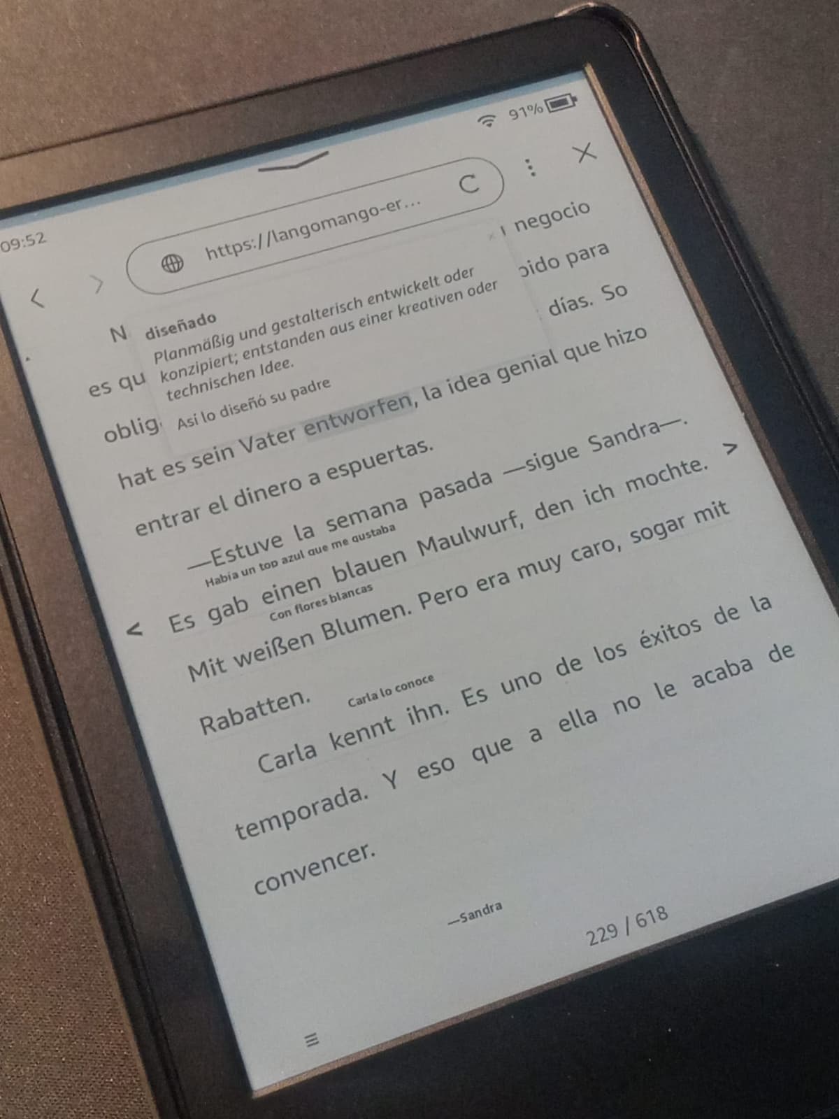 E-reader showing Spanish/English mixed text with pop-up translations